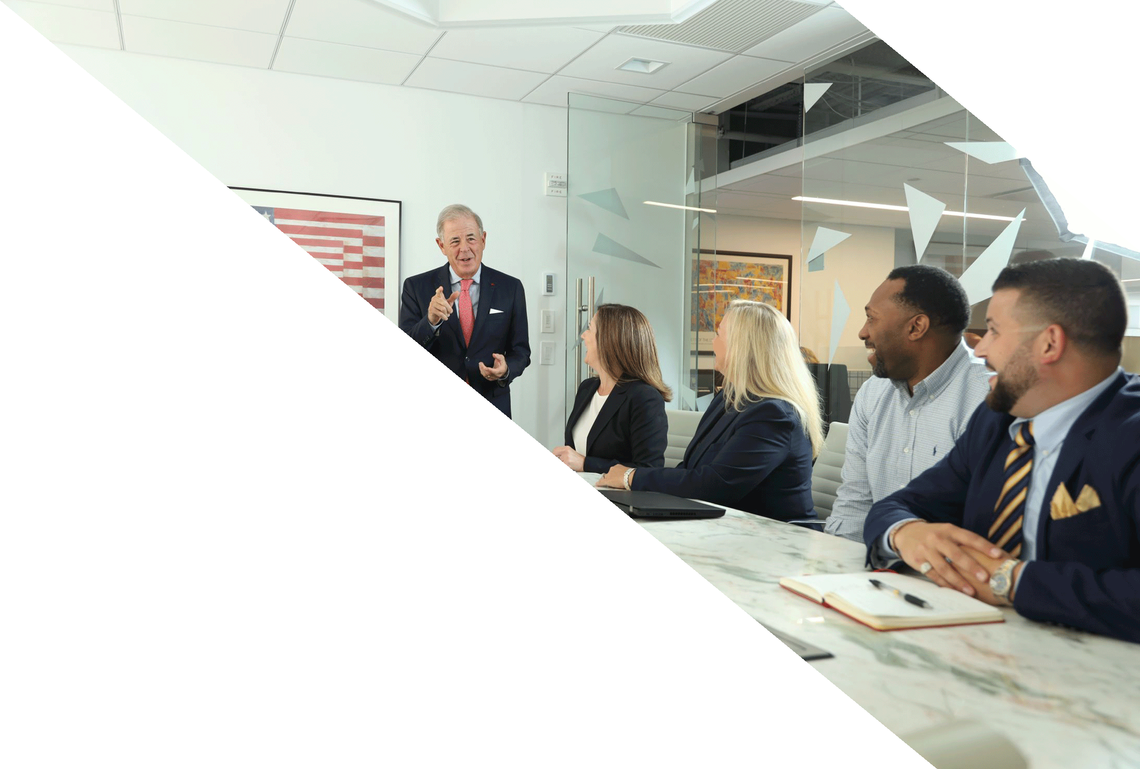 Continental employees gathered around a conference room table, attentively listening to a presenter discussing Financial Solutions.